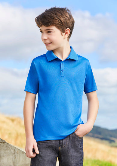 Image showing a child playing outdoors in a Carbon Short Sleeve Kids Polo.