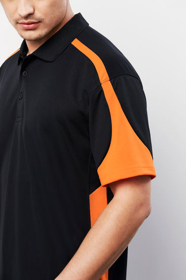 Image of a man sporting an Arctic Sports Mesh Men's Polo during an athletic event.