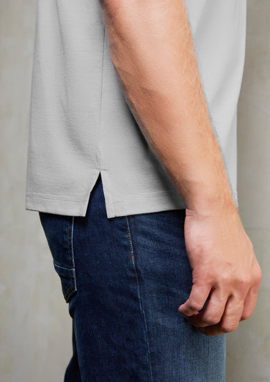 Image of a man in a Midnight Cross-Dyed Fabric Men's Polo at an evening social event.