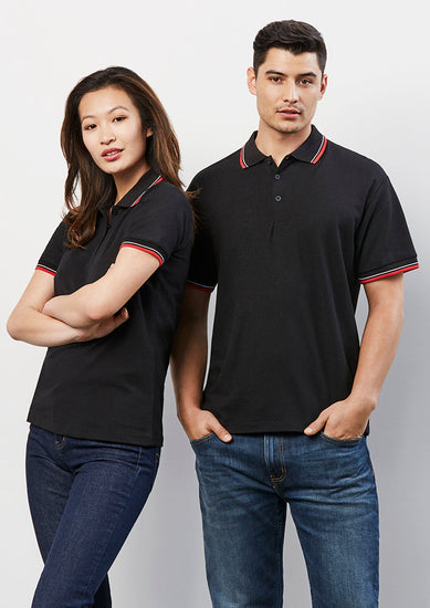 Image showing a man wearing an Astro Cotton-Backed Men's Polo at a community sports event.